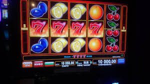 Filipino player browsing the 77bet online slots lobby on a smartphone